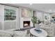 Comfortable living room showcases a fireplace, stylish decor, and plenty of natural light at 718 Parish Rd, Charleston, SC 29407