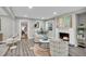 Inviting living room with fireplace, stylish furniture, and an open doorway to a cozy bedroom at 718 Parish Rd, Charleston, SC 29407