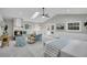 Spacious bedroom featuring a cozy fireplace, skylight, and comfortable seating at 718 Parish Rd, Charleston, SC 29407