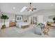 Bright main bedroom with vaulted ceiling, seating area and decorative furnishings at 718 Parish Rd, Charleston, SC 29407