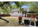 Large backyard featuring a playset, seating, lush foliage and shade trees at 638 Stono Edge Dr, Charleston, SC 29412