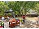 Spacious backyard featuring outdoor kitchen, mature trees, and a playset perfect for Gathering fun at 638 Stono Edge Dr, Charleston, SC 29412