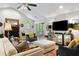 Airy living room showcasing a fireplace, a vaulted ceiling, and access to an outdoor seating area at 638 Stono Edge Dr, Charleston, SC 29412