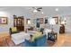 Well-decorated living space with hardwood floors, comfortable sofas, and built-in display cabinet at 638 Stono Edge Dr, Charleston, SC 29412