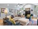 Open-concept living area featuring a fireplace, hardwood floors, and comfortable seating arrangements at 638 Stono Edge Dr, Charleston, SC 29412