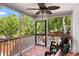 Relaxing screened-in porch featuring comfortable seating and views of the lush backyard at 638 Stono Edge Dr, Charleston, SC 29412