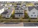 Aerial view of a lovely home in a well-planned community surrounded by lush landscaping and neighborhood streets at 716 Triangle Ln, Summerville, SC 29486