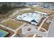 An aerial view of the clubhouse featuring a large pool with water features and a surrounding amenity area at 716 Triangle Ln, Summerville, SC 29486