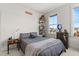 Bedroom with a gray comforter, soft carpeting, and a brightly lit window at 716 Triangle Ln, Summerville, SC 29486