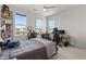 Bedroom features large windows, plush carpeting, and a dedicated desk and workspace at 716 Triangle Ln, Summerville, SC 29486