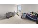 Bedroom with light walls, carpet flooring and a well made bed with toys and decor at 716 Triangle Ln, Summerville, SC 29486