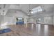 Clubhouse interior featuring a TV area, multiple doors to the outside, vaulted ceilings, and vinyl floors at 716 Triangle Ln, Summerville, SC 29486