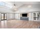 Spacious clubhouse interior featuring neutral colors, wood look floors, TV, and doors to the exterior at 716 Triangle Ln, Summerville, SC 29486