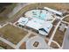 A community clubhouse with a resort-style pool, palm trees, and lounge seating offering relaxation and fun at 716 Triangle Ln, Summerville, SC 29486