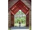 Personal riding bike through covered wooden structure into wooded area at 716 Triangle Ln, Summerville, SC 29486