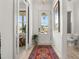 Bright entryway with stylish décor, modern lighting, and a glimpse of the office through sliding doors at 716 Triangle Ln, Summerville, SC 29486