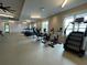 Well-equipped gym with multiple treadmills, elliptical machines, bikes, and windows for natural light at 716 Triangle Ln, Summerville, SC 29486