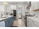 Modern kitchen features white cabinets, stainless steel appliances, and quartz countertops at 716 Triangle Ln, Summerville, SC 29486