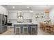 Modern kitchen with stainless steel appliances, a large island, and stylish pendant lighting at 716 Triangle Ln, Summerville, SC 29486