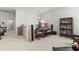 Bright living room features an entertainment center, with large speakers and a bookcase at 716 Triangle Ln, Summerville, SC 29486