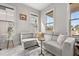 Cozy living room with a large sectional sofa, a round side table, and abundant natural light from multiple windows at 716 Triangle Ln, Summerville, SC 29486