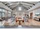 Spacious lounge with vaulted ceilings, modern furniture, and large windows, perfect for relaxation and community gatherings at 716 Triangle Ln, Summerville, SC 29486