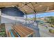 Spacious outdoor lounge area with tables, chairs, and shelter for gathering with friends at 716 Triangle Ln, Summerville, SC 29486
