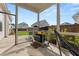 Screened porch featuring outdoor cooking area with a grill and pizza oven, and seating at 716 Triangle Ln, Summerville, SC 29486