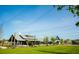 Exterior view of community clubhouse set back on green lawn at 760 Blueway Ave, Summerville, SC 29486