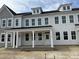 New construction townhouse featuring gray siding, a front porch with white columns, and multiple windows at 760 Blueway Ave, Summerville, SC 29486
