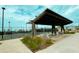 Enjoy a covered pavilion with seating next to the community pickleball courts and professionally landscaped features at 760 Blueway Ave, Summerville, SC 29486