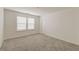 This bedroom features neutral walls, carpet and a window providing bright, natural light at 802 S Pointe Blvd, Summerville, SC 29483
