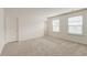This bedroom features neutral walls, carpet and multiple windows providing bright, natural light at 802 S Pointe Blvd, Summerville, SC 29483