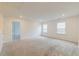 Bonus room with neutral walls, carpet, multiple windows providing bright, natural light and multiple entryways at 802 S Pointe Blvd, Summerville, SC 29483