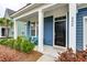 Inviting front porch with comfortable seating, stylish decor, and a welcoming entrance to the home at 802 S Pointe Blvd, Summerville, SC 29483