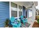 Comfortable seating on the porch of this inviting home. Landscaping and decorations adorn the entryway at 802 S Pointe Blvd, Summerville, SC 29483