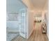 Well-lit hallway featuring hardwood floors and an open view of a living space, creating a welcoming atmosphere at 802 S Pointe Blvd, Summerville, SC 29483