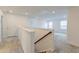 Bright hallway features neutral walls and carpet, leading to open space with natural light from window views at 802 S Pointe Blvd, Summerville, SC 29483
