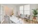Bright home office with french doors, natural light, a writing desk, and cozy chairs at 802 S Pointe Blvd, Summerville, SC 29483