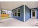 Covered outdoor patio with blue siding, a concrete floor, and a view of the backyard at 802 S Pointe Blvd, Summerville, SC 29483
