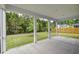 Screened-in porch with views of a fenced yard and wooded area, perfect for outdoor living and relaxation at 802 S Pointe Blvd, Summerville, SC 29483