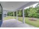 Covered screened porch providing views of the spacious backyard and surrounding greenery at 802 S Pointe Blvd, Summerville, SC 29483