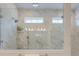 Luxurious shower with marble tiling, glass doors, and dual shower heads and light at 802 S Pointe Blvd, Summerville, SC 29483