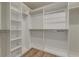 Spacious walk-in closet with custom white shelving and hardwood floors providing ample storage at 802 S Pointe Blvd, Summerville, SC 29483