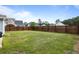 Large, fenced backyard featuring a well-maintained lawn and plenty of space for outdoor activities at 8402 Loggers Run, North Charleston, SC 29420