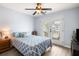 This bedroom includes a queen bed, ceiling fan and access to an outdoor balcony through beautiful french doors at 8402 Loggers Run, North Charleston, SC 29420