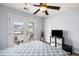 This bedroom includes a queen bed, ceiling fan and access to an outdoor balcony through beautiful french doors at 8402 Loggers Run, North Charleston, SC 29420