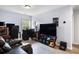 Spacious game room with a TV, gaming setup, and comfortable seating at 8402 Loggers Run, North Charleston, SC 29420