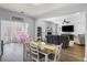 Bright and airy living room with a dining area and access to a sunroom at 8402 Loggers Run, North Charleston, SC 29420