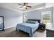 Calming main bedroom with trey ceilings, hardwood floors, and large windows at 8402 Loggers Run, North Charleston, SC 29420